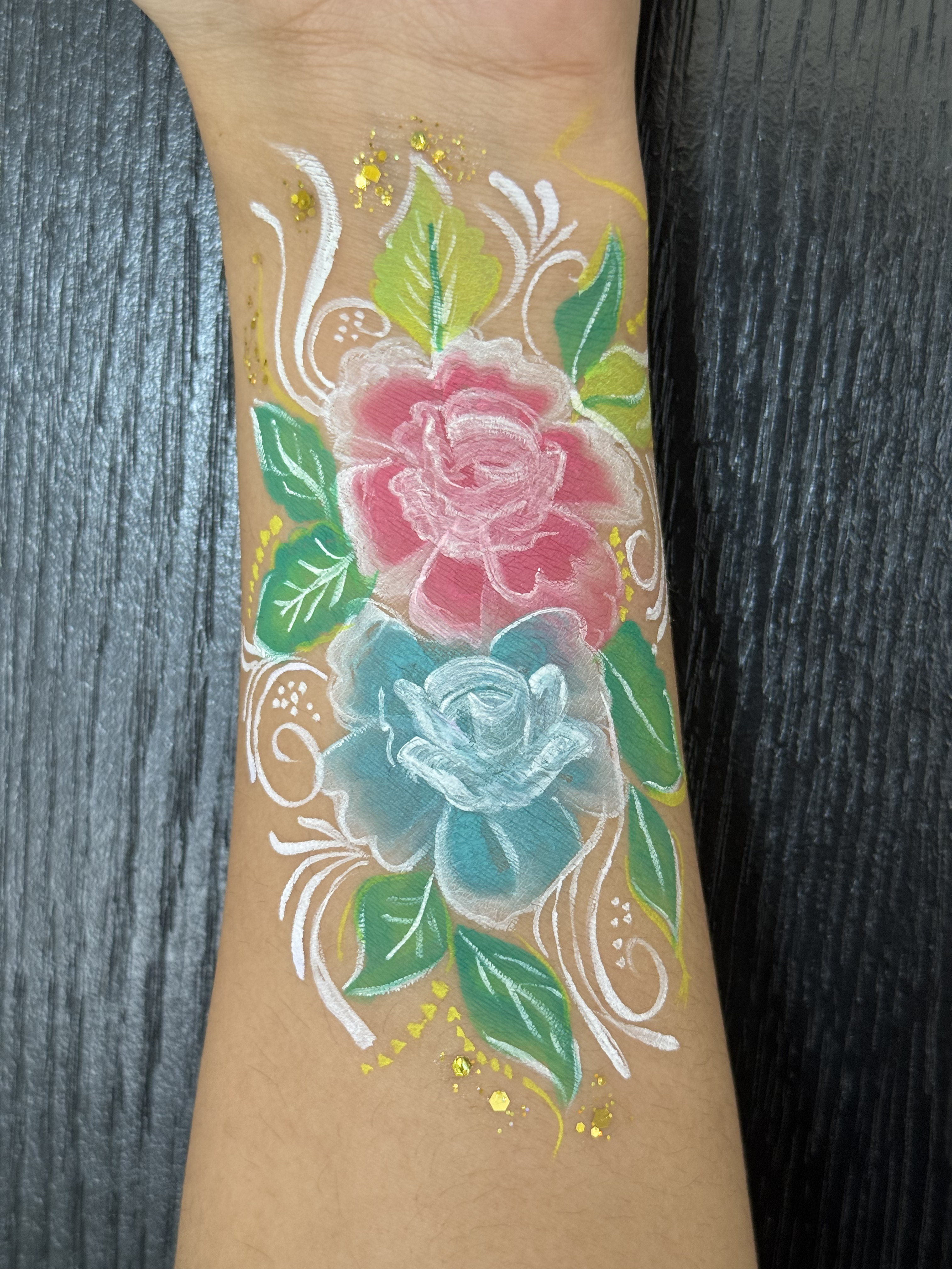 Floral design with soft blended roses and subtle glitter accents.