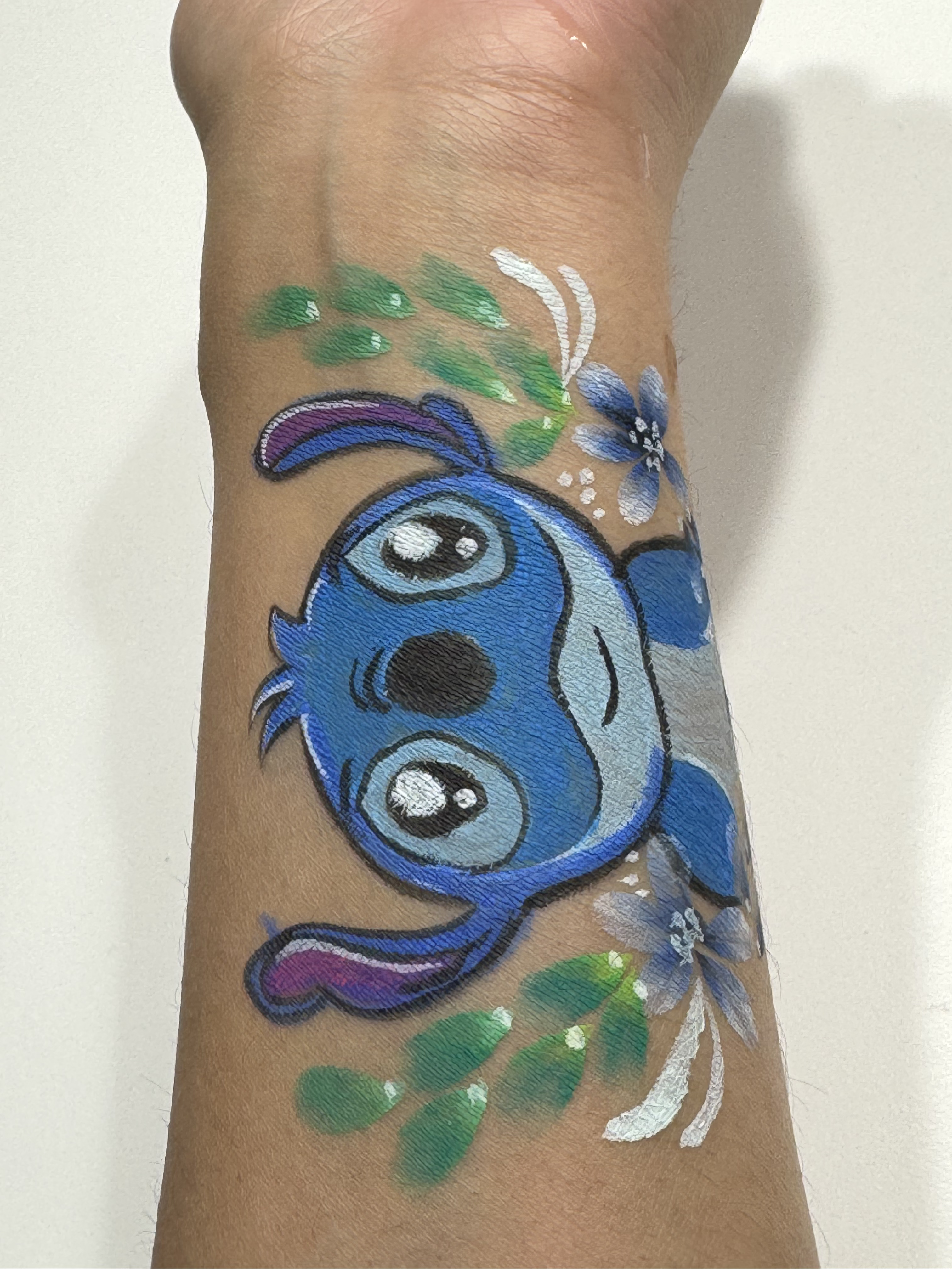 Cute blue character with floral accents.