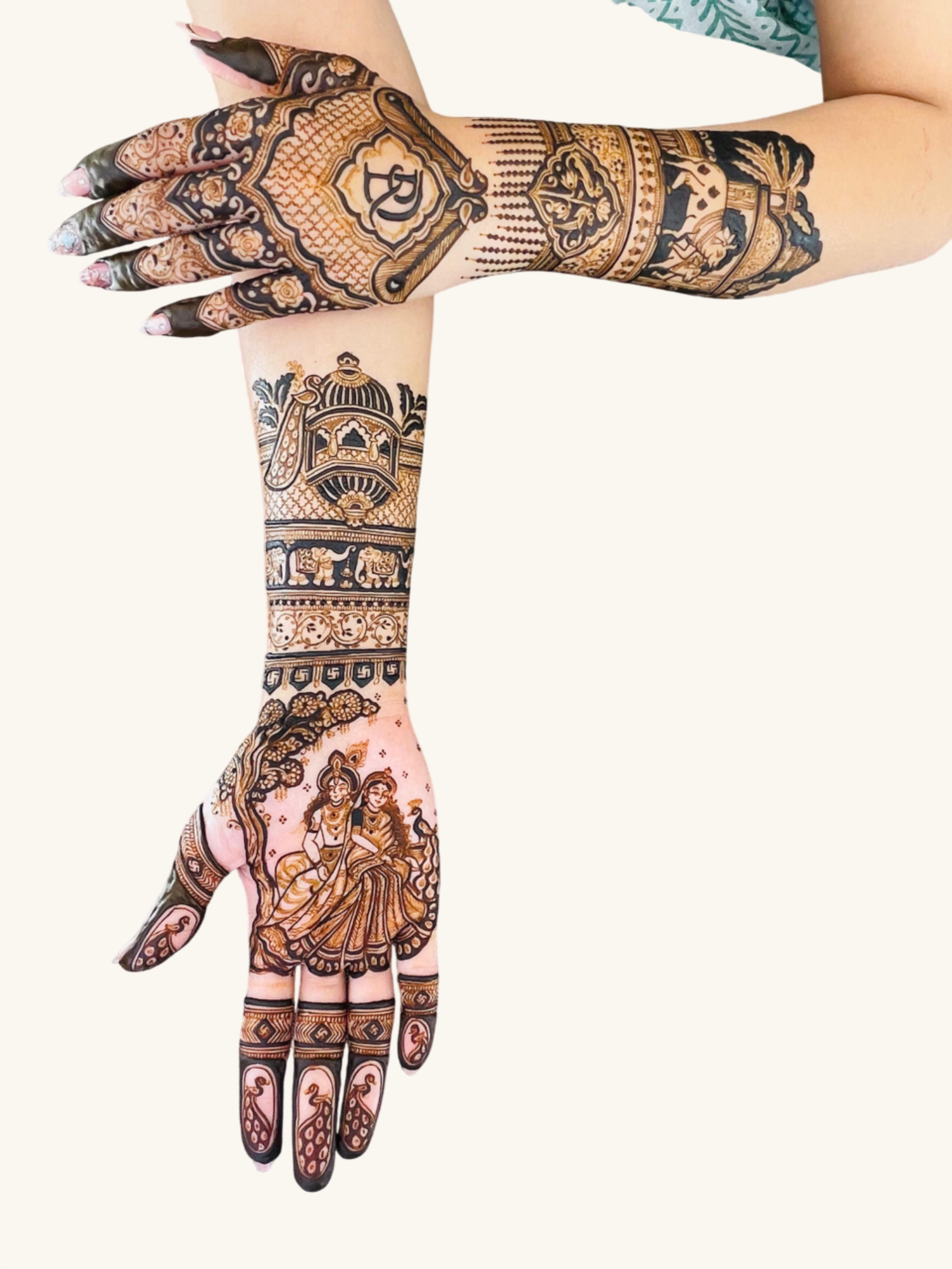 Artist applying henna on a client's hand